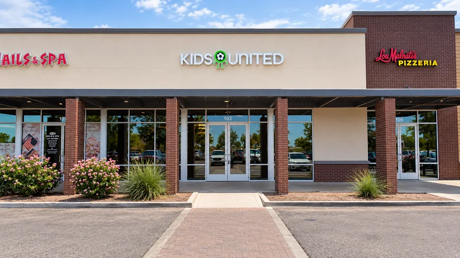 Kids United Sports Gym: Completed Kids United storefront with readable sign and entrance