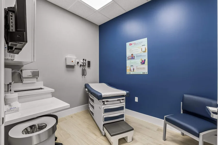MY DR NOW: MY DR NOW examination room with exam table and clinical equipment
